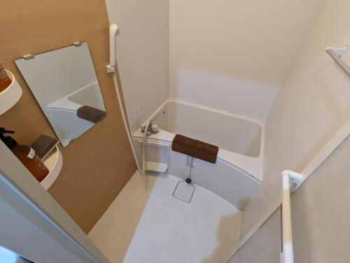 an overhead view of a bathroom with stairs and a mirror at Amber Iidabashi - Vacation STAY 87072v in Tokyo