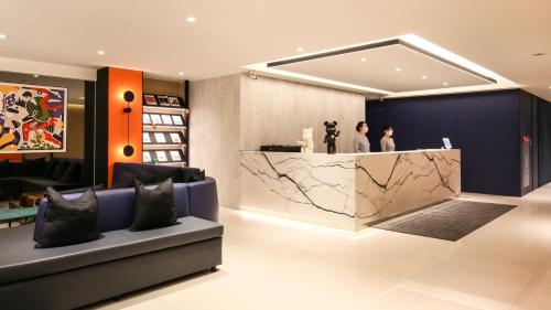 a lobby of a store with a marble counter at CityInn Hotel Taipei Station Branch III in Taipei