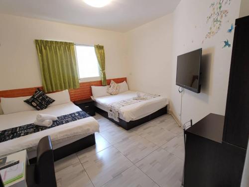 Katil atau katil-katil dalam bilik di Especially chef's home B&B