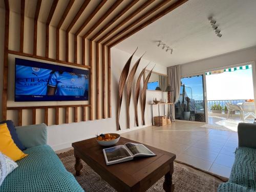 a living room with a couch and a table at My Ocean - Cliff & Ocean View in Acantilado de los Gigantes