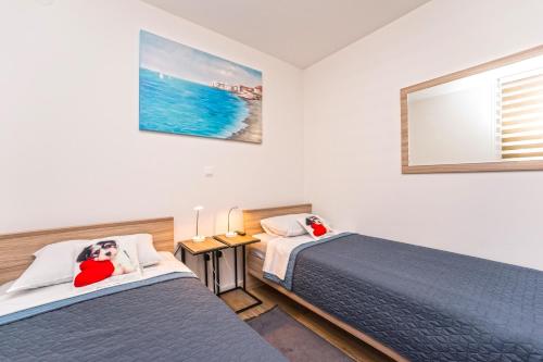 Ένα ή περισσότερα κρεβάτια σε δωμάτιο στο Relax Apartments