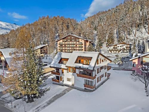 an aerial view of a house in the snow at Rosatsch 13 in Surlej