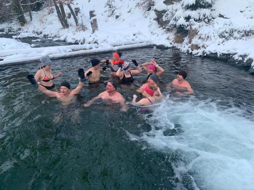 a group of people in a pool of water at Willa Marianna in Lądek-Zdrój