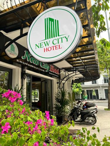 a new city hotel with motorcycles parked outside of it at NEW CITY HOTEL in Tây Ninh