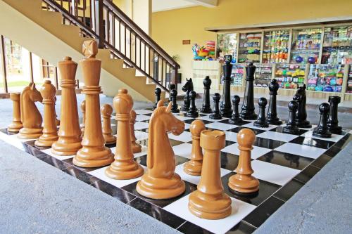 a chess board with chess pieces on it at Banyu Biru Villa in Lagoi