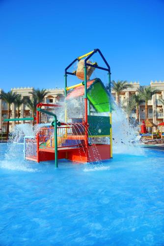 a water park with a water slide in the water at Pickalbatros Palace - Aqua Park Hurghada in Hurghada