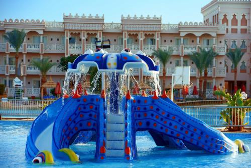 a water slide in the water at a resort at Pickalbatros Palace - Aqua Park Hurghada in Hurghada