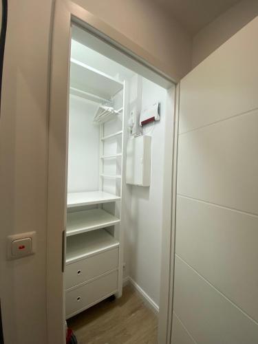 a walk in closet with a glass door at Prinz Hamlet Wohnung 60 in Pelzerhaken