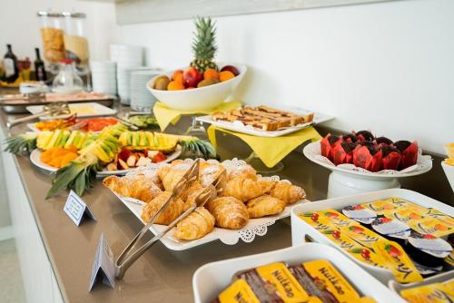 a buffet with many different types of food on a table at Residenza Turistica Alberghiera Blue Marine in Bibione