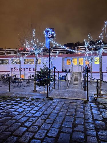 a train station at night with christmas lights at River hotel KÖNIGSTEIN in Prague