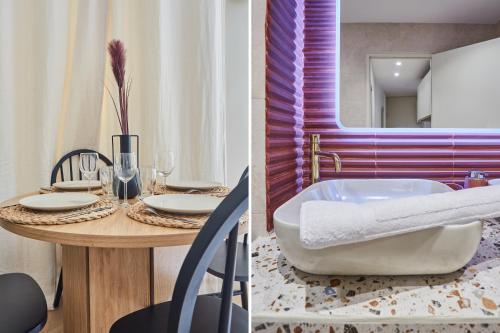 Habitación con baño con mesa y bañera. en Apartment Notre Dame de Paris by Studio prestige, en París