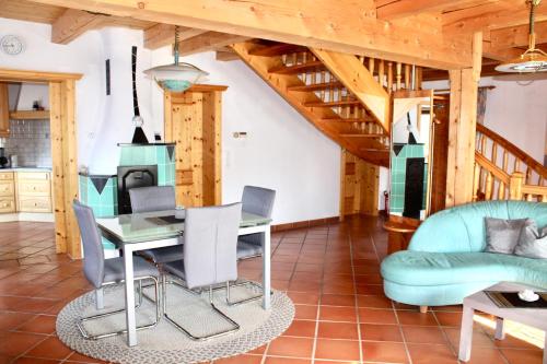 a kitchen and dining room with a table and chairs at Berghaus Egg in Jerzens