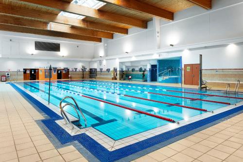a large swimming pool in a large building at DCU Rooms in Dublin