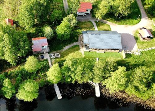 an aerial view of a farm with a house and a river at Evon Luonto Oy - Aulangon Rantala in Aulanko