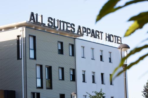a building with a sign on the top of it at All Suites Appart Hôtel - Pau - Zénith in Pau