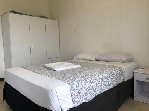 two beds sitting next to each other in a bedroom at Hotel Bar Restaurant Emergency 911 STO LK GROUP in Paramaribo