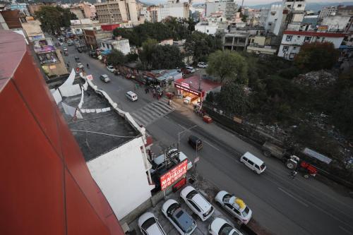 an overhead view of a busy city street with cars at Mahadev Hotel and Resorts in Katra