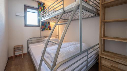 a bunk bed room with two bunk beds at Grand Morillon-309 Appart vue pistes- 5 pers in Morillon