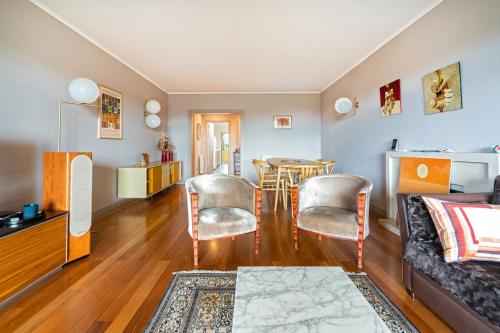 a living room with a couch and a table at Verde Mar Cascais Apartment in Estoril