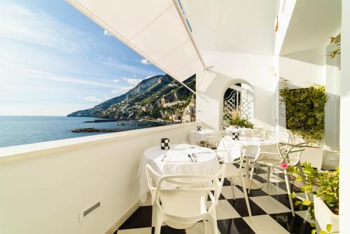 a restaurant with a view of the ocean at Palazzo Don Salvatore in Amalfi