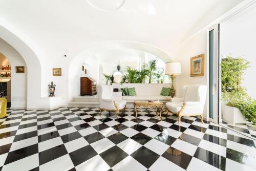 a living room with a black and white checkered floor at Palazzo Don Salvatore in Amalfi