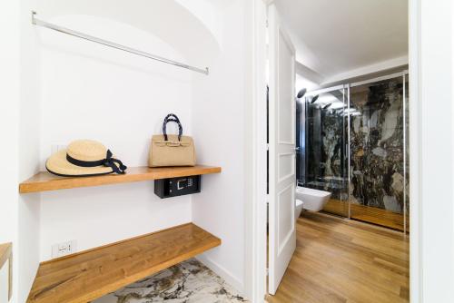 a room with a hallway with wooden shelves at Palazzo Don Salvatore in Amalfi