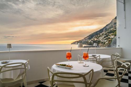 a dining room with a view of the ocean at Palazzo Don Salvatore in Amalfi