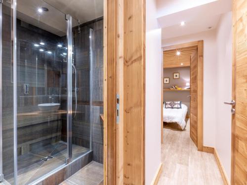 a bathroom with a shower with a glass door at Appartement spacieux avec wifi, parking, balcon Sud à 10 min des commodités - FR-1-694-33 in Val dʼIsère