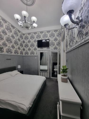 Postel nebo postele na pokoji v ubytování Radac Residence