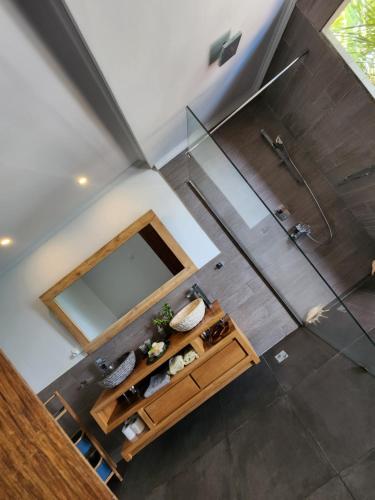 an overhead view of a bathroom with a shower at Marquise & Infinity villas in Glacis