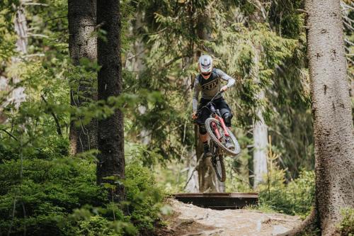 a person jumping a dirt bike in the air at Apartmán Holia, Kubínska Hoľa in Dolný Kubín