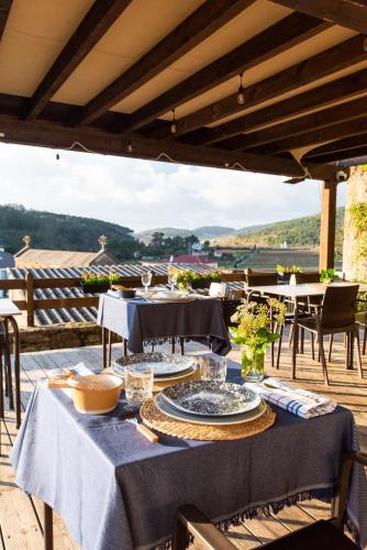 a table with a blue table cloth on a patio at LIRESCA in Lires