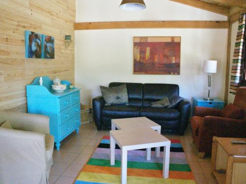 a living room with a couch and a table at Holiday Home in Covas near Serra da Estrela in Covas
