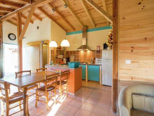 a kitchen and dining room with a table and chairs at Holiday Home in Covas near Serra da Estrela in Covas