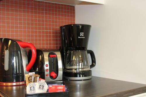 Kavos ir arbatos ruošimo rinkinys apgyvendinimo įstaigoje Hotel Torslanda