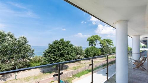 a balcony with a view of the ocean at Ultra Marine by Zdrojowa in Kołobrzeg