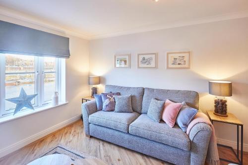 a living room with a couch and a window at Host & Stay - Harbour View in Whitby
