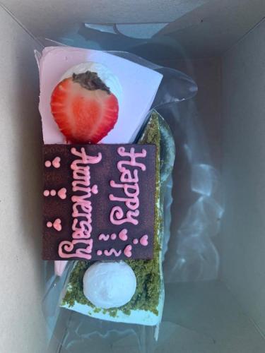 a cake in a plastic bag with a strawberry on it at Relax At Gold Coast Morib in Banting