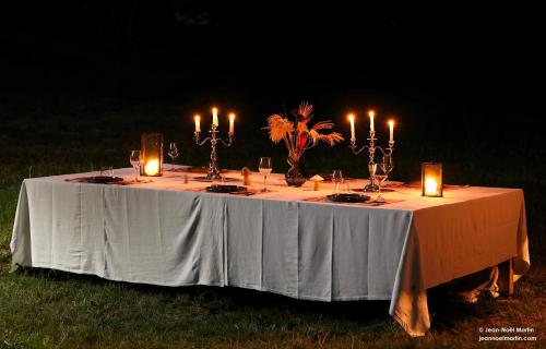 a white table with candles on top of it at Le Domaine de Moroges in Moroges
