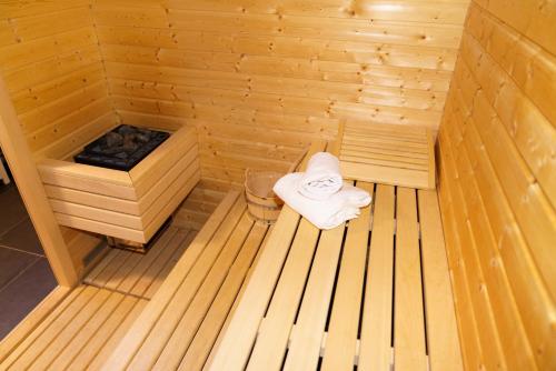 a wooden sauna with a towel sitting in it at FeWo Nocky in Turracher Hohe