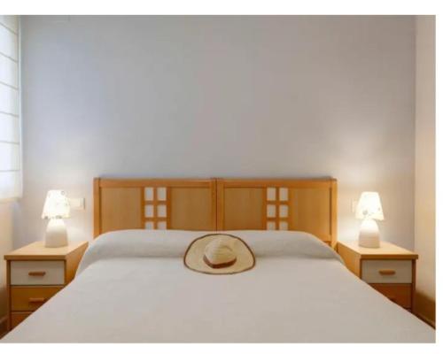 A bed or beds in a room at La Riviera