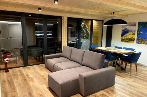 a living room with a couch and a table at Villa Alpiyka in Slavske