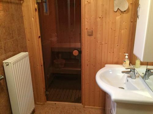 a bathroom with a shower and a sink at Príma Vendégház in Tiszakécske