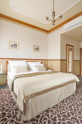 a bedroom with a large bed in a room at Chateau St. Havel - Wellness Hotel in Prague