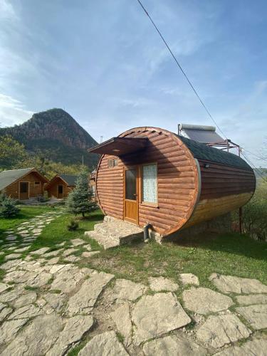 a small wooden house with a boat on top of it at Harsnadzor Eco Resort in Halidzor