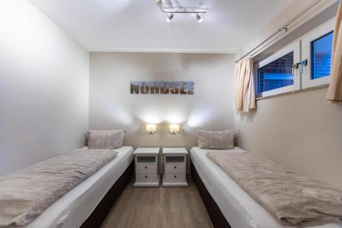En eller flere senge i et værelse på Ferienwohnung Beeke