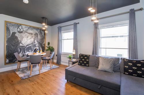 a living room with a couch and a table at Spurriergate Apartments- In the heart of the city centre in York