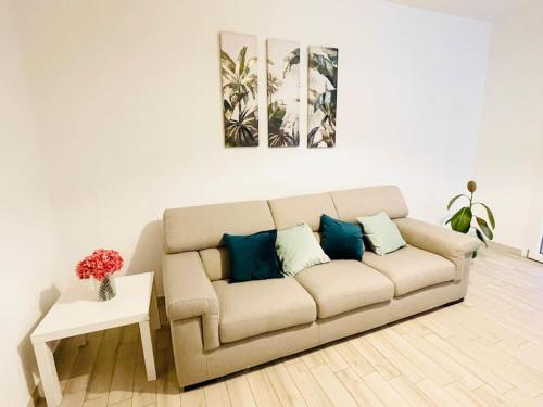 a living room with a couch and a table at Emme Apartment IUN (Q8410) in Cagliari