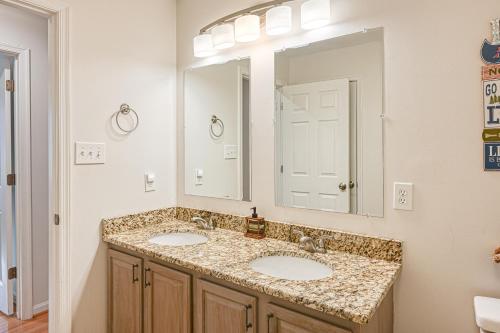 a bathroom with two sinks and a large mirror at Sunny Side Up in Mineral