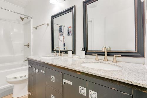 a bathroom with two sinks and a toilet at Drew Valley Villa in Atlanta